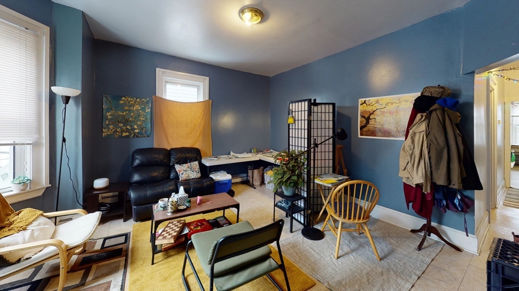 36 Mozart Street, Unit 2 Boston, MA 02130 - Photo 7 of 9 a living room with furniture and a closet