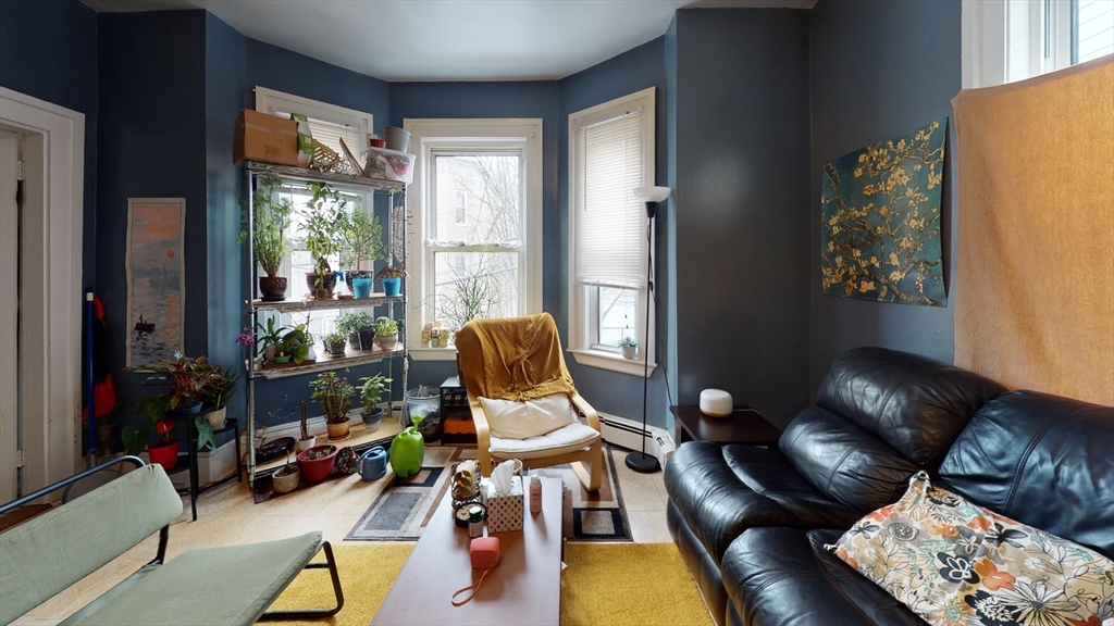 36 Mozart Street, Unit 2 Boston, MA 02130 - Photo 8 of 9 a living room with furniture and wooden floor