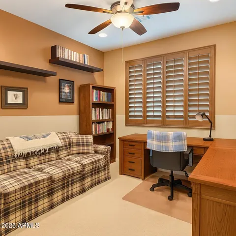 a workspace with furniture and a window