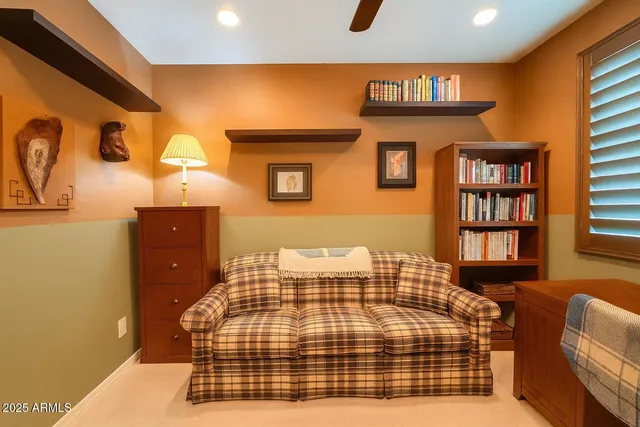 a bedroom with a bed and dresser