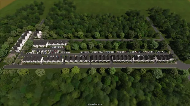 a large green field with lots of palm trees