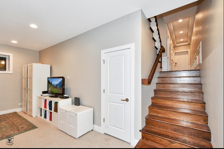 2453 West Irving Park Road, Unit 1E Chicago, IL 60618 - Photo 13 of 23 a view of entryway and hall with wooden floor