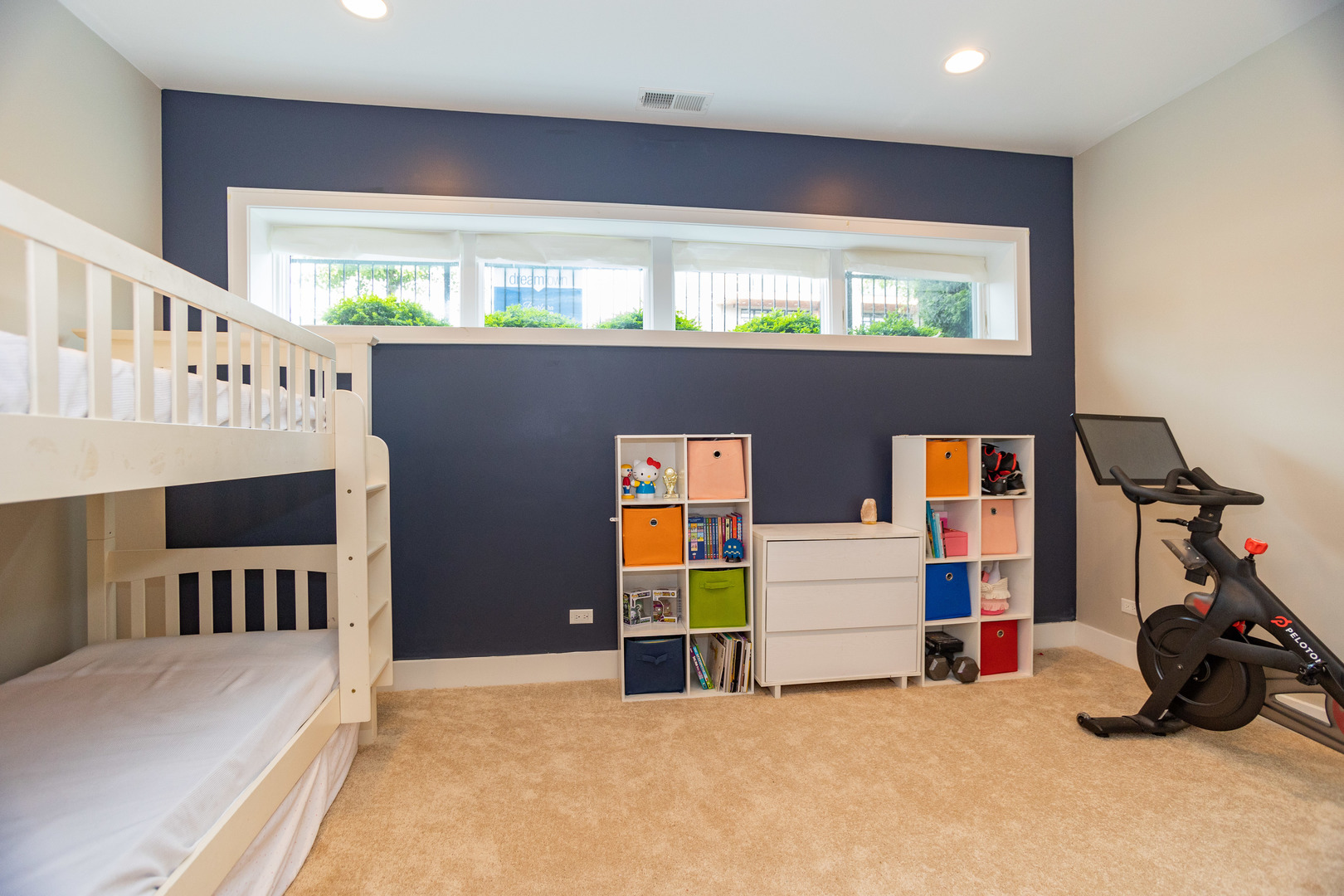 2453 West Irving Park Road, Unit 1E Chicago, IL 60618 - Photo 16 of 23 a bedroom with furniture and a window