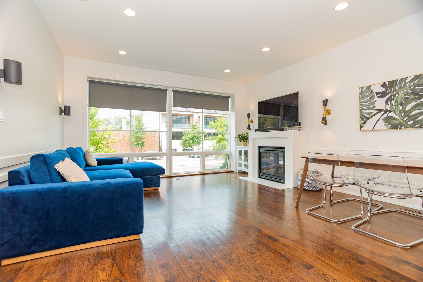 2453 West Irving Park Road, Unit 1E Chicago, IL 60618 - Photo 3 of 23 a living room with fireplace furniture and a flat screen tv
