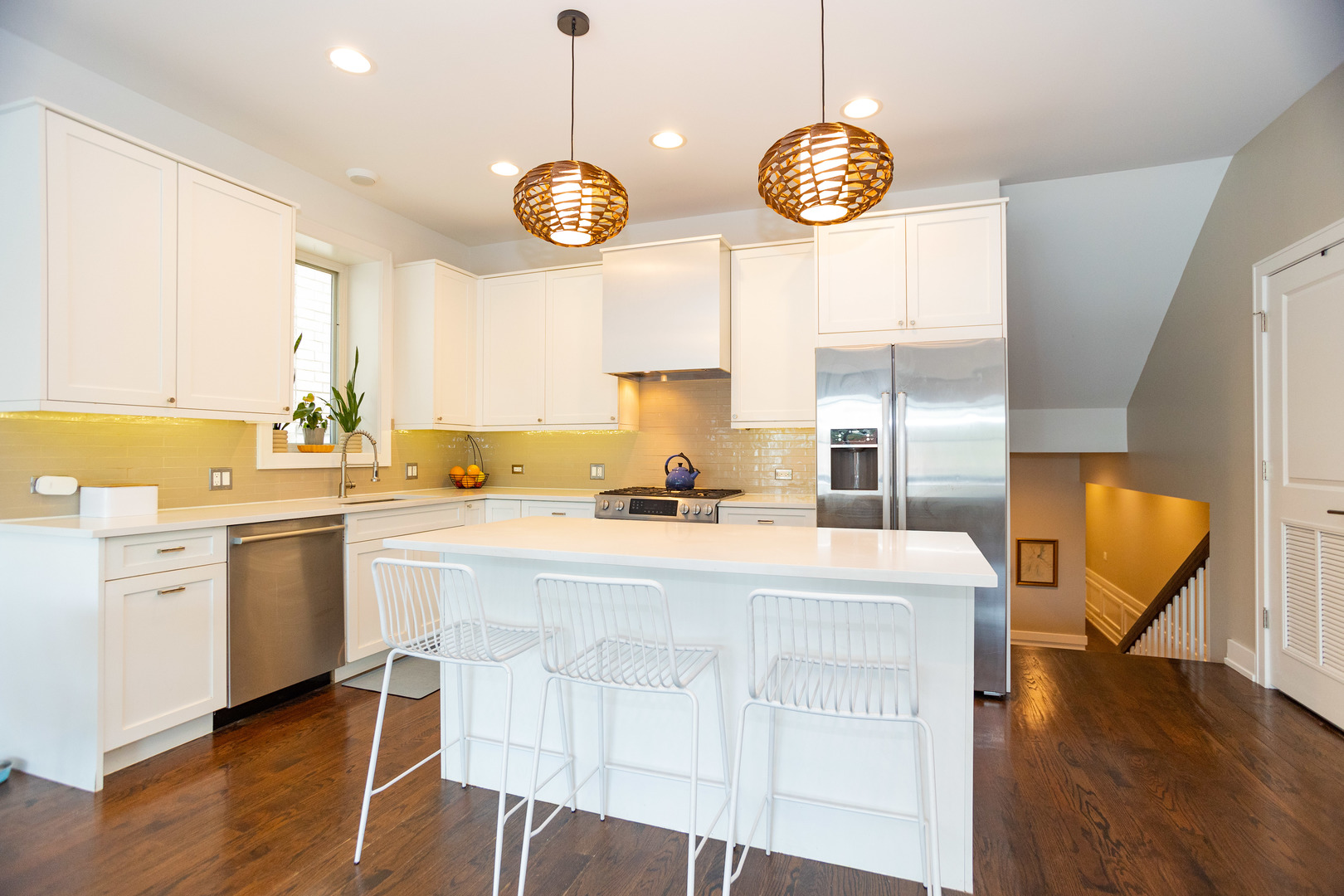 2453 West Irving Park Road, Unit 1E Chicago, IL 60618 - Photo 5 of 23 a view of living room with granite countertop furniture and fireplace