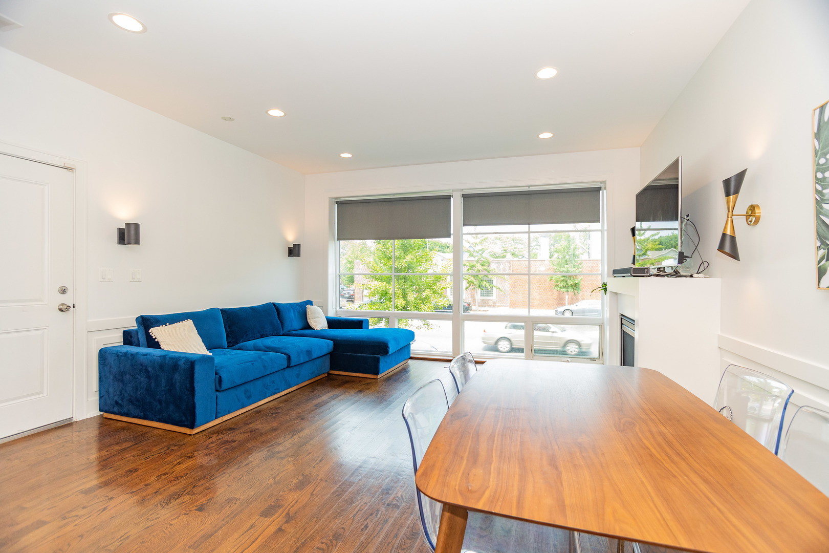 2453 West Irving Park Road, Unit 1E Chicago, IL 60618 - Photo 7 of 23 a living room with furniture and large windows
