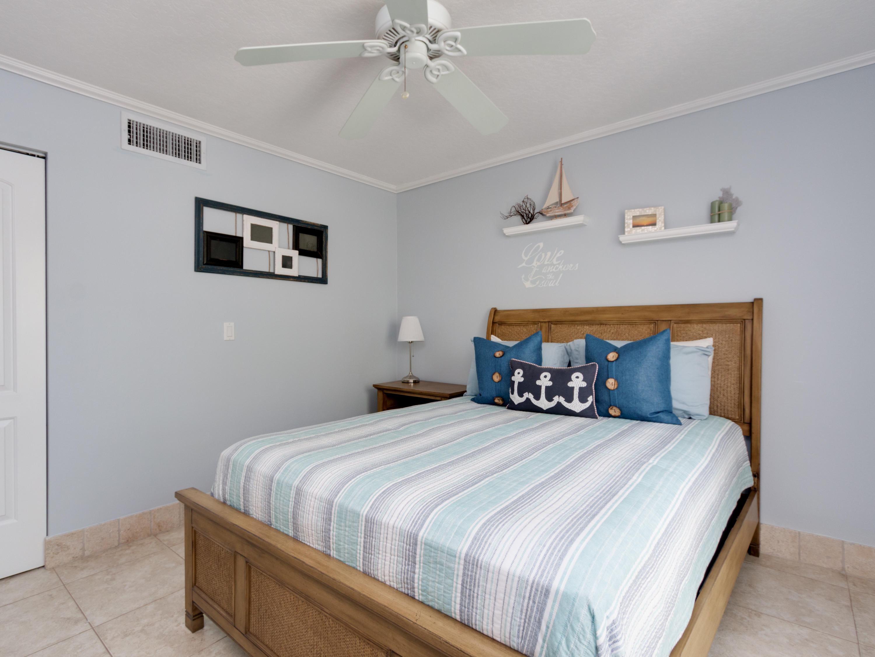 765 Jeffery Street, Unit 1301 Boca Raton, FL 33487 - Photo 13 of 31 a bedroom with a bed and a chandelier