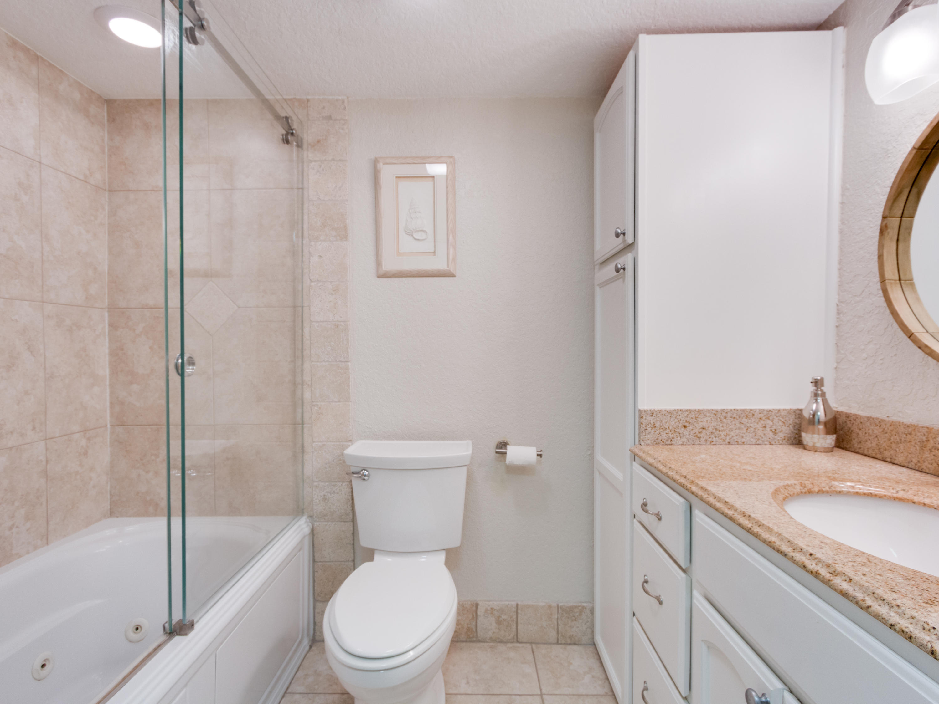 765 Jeffery Street, Unit 1301 Boca Raton, FL 33487 - Photo 14 of 31 a bathroom with a granite countertop sink toilet and shower