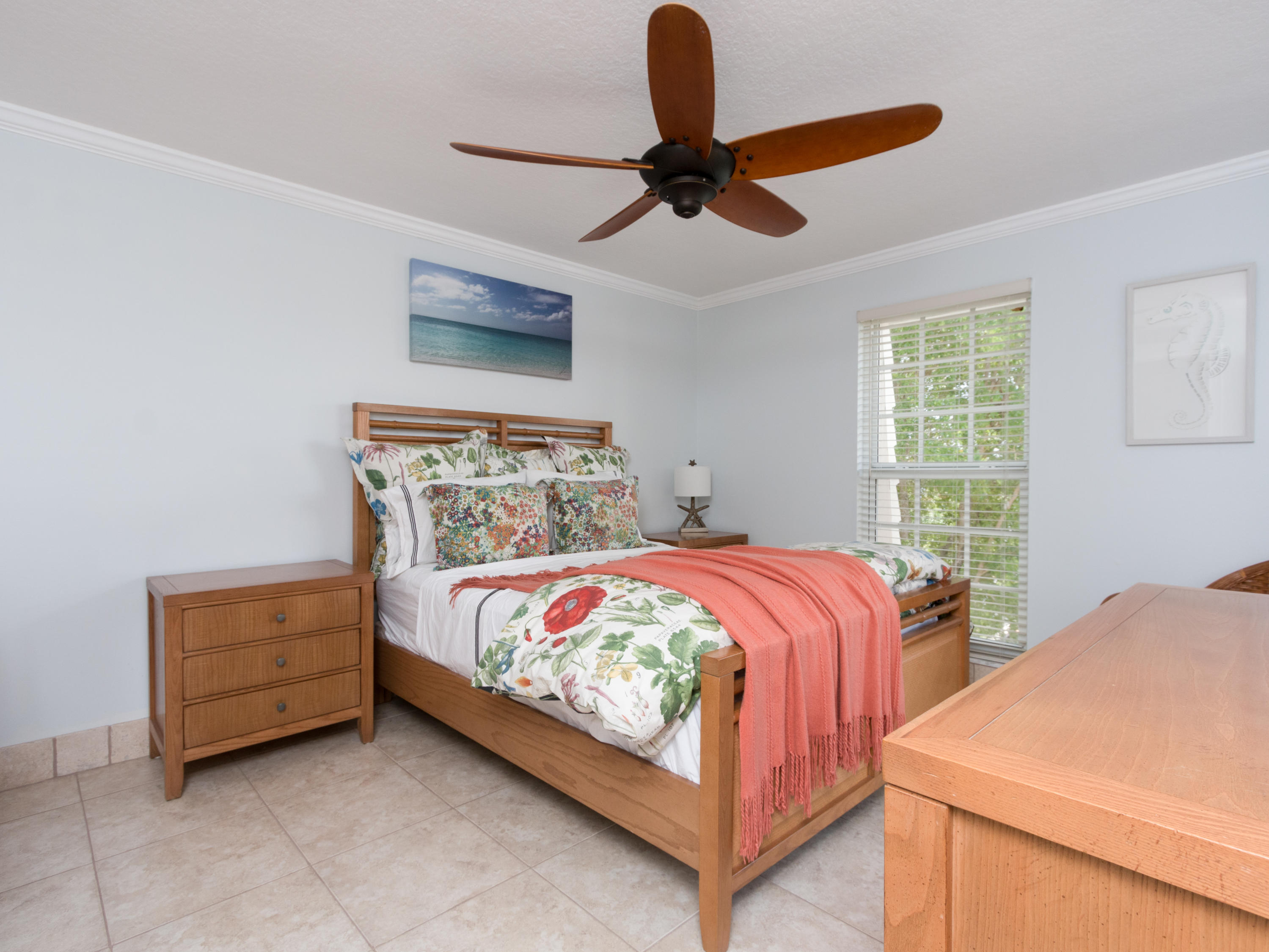 765 Jeffery Street, Unit 1301 Boca Raton, FL 33487 - Photo 16 of 31 a bedroom with a bed and a ceiling fan