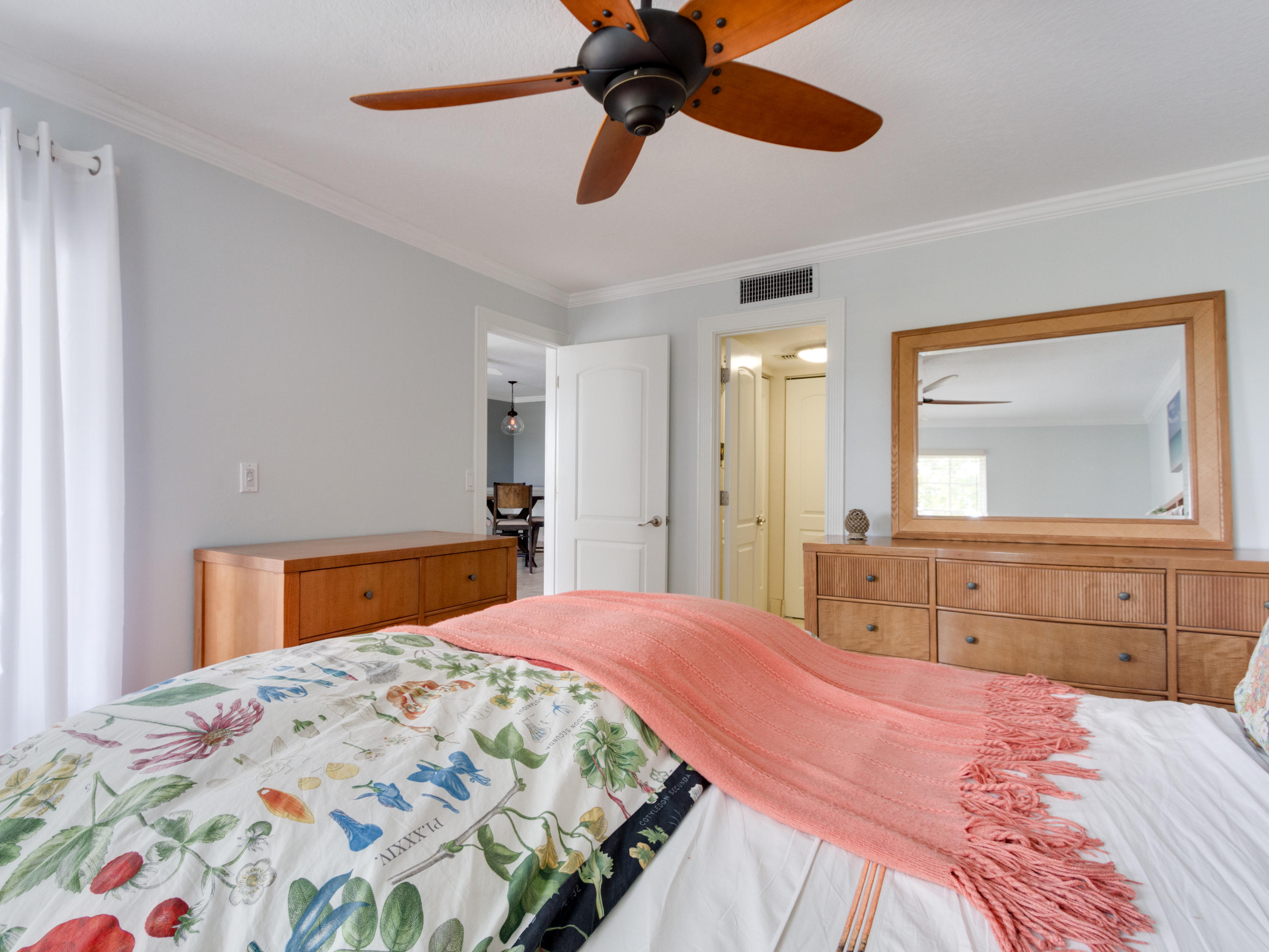 765 Jeffery Street, Unit 1301 Boca Raton, FL 33487 - Photo 17 of 31 a bedroom with a bed and a chandelier