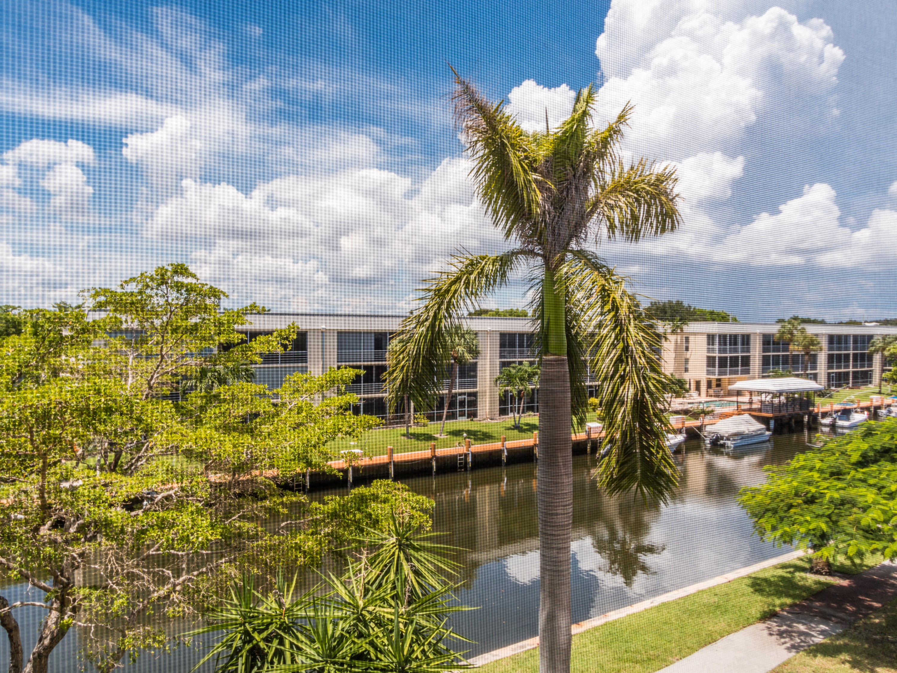 765 Jeffery Street, Unit 1301 Boca Raton, FL 33487 - Photo 19 of 31 a view of houses with swimming pool and lake view