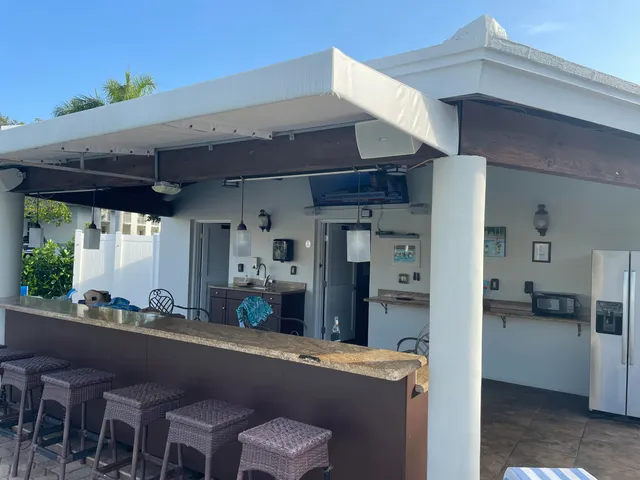 a kitchen with a table and chairs in it