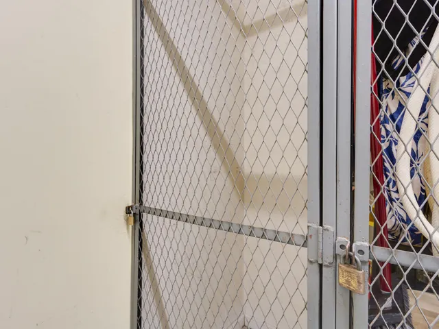 a view of a patio with table and chairs potted plants and large tree