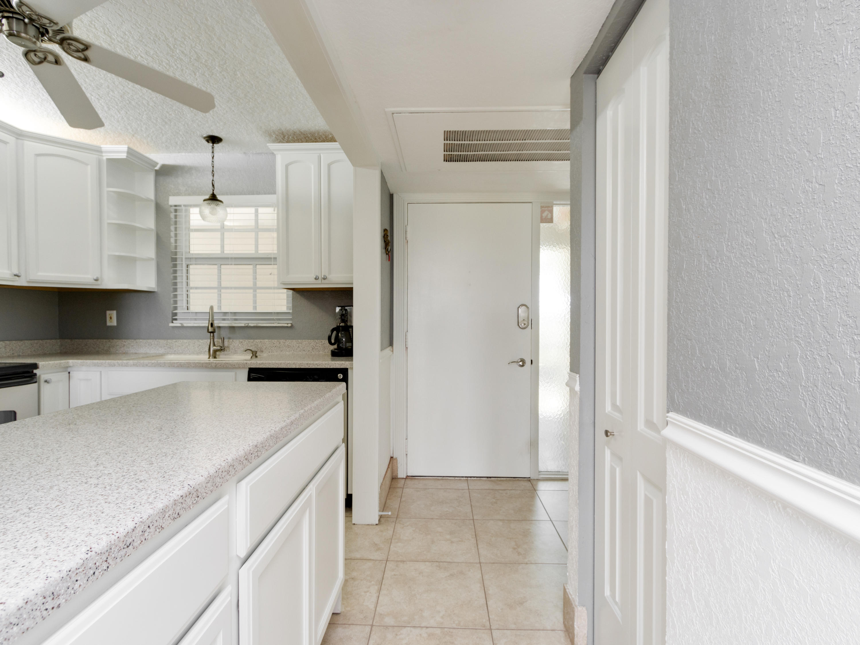 765 Jeffery Street, Unit 1301 Boca Raton, FL 33487 - Photo 3 of 31 a kitchen with granite countertop a sink dishwasher a refrigerator and a stove