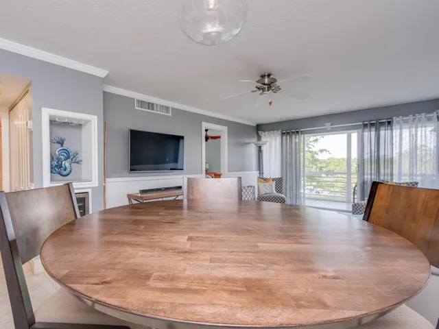 a living room with fireplace furniture and a flat screen tv
