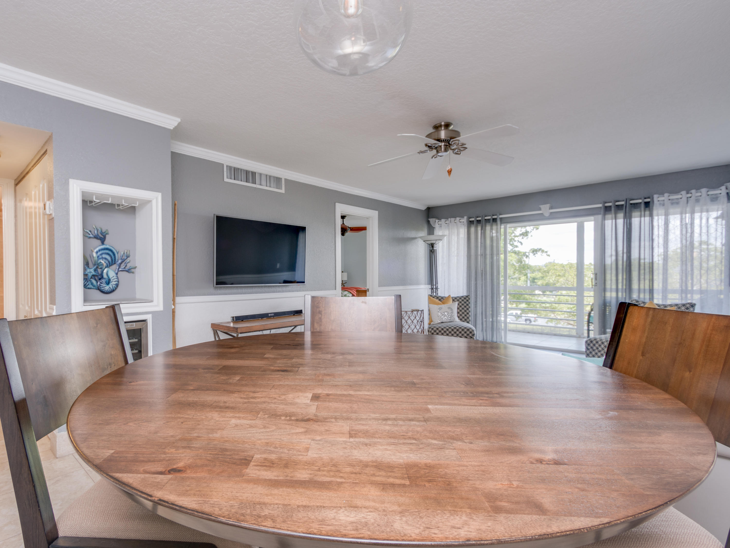 765 Jeffery Street, Unit 1301 Boca Raton, FL 33487 - Photo 6 of 31 a living room with fireplace furniture and a flat screen tv