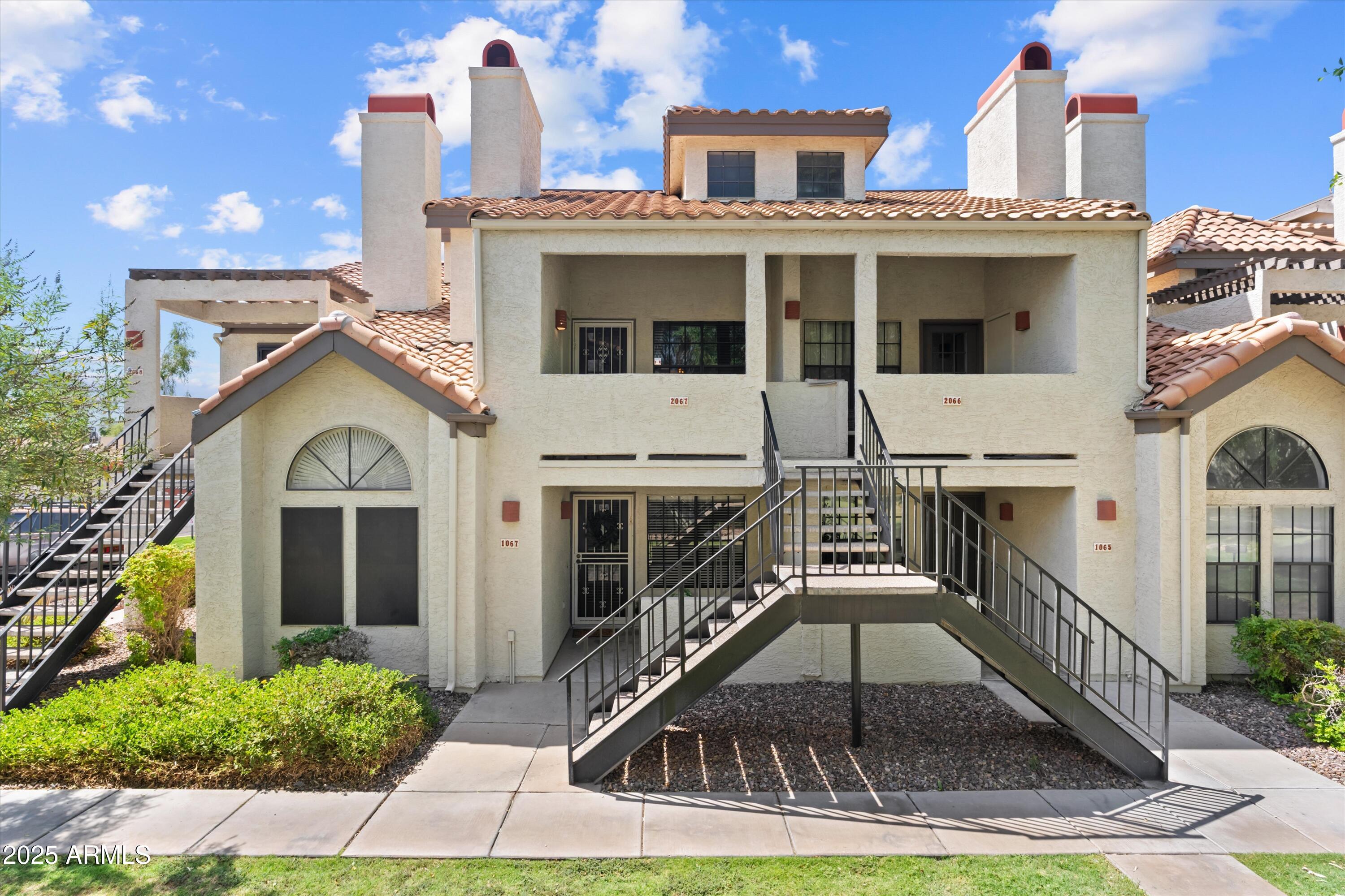 a view of a house with entrance gate