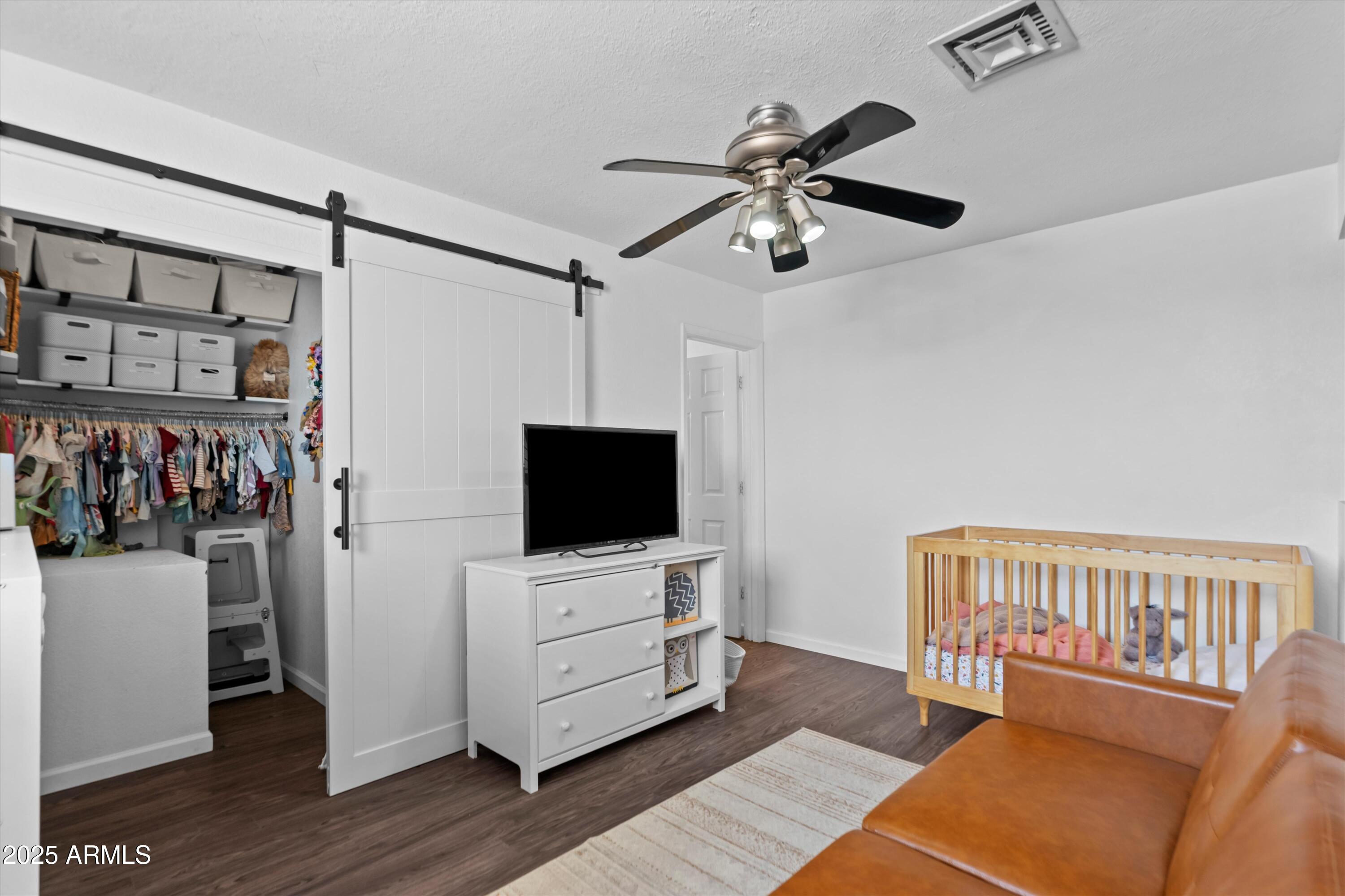 2333 East Southern Avenue, Unit 2067 Tempe, AZ 85282 - Photo 16 of 32 a living room with furniture and a flat screen tv