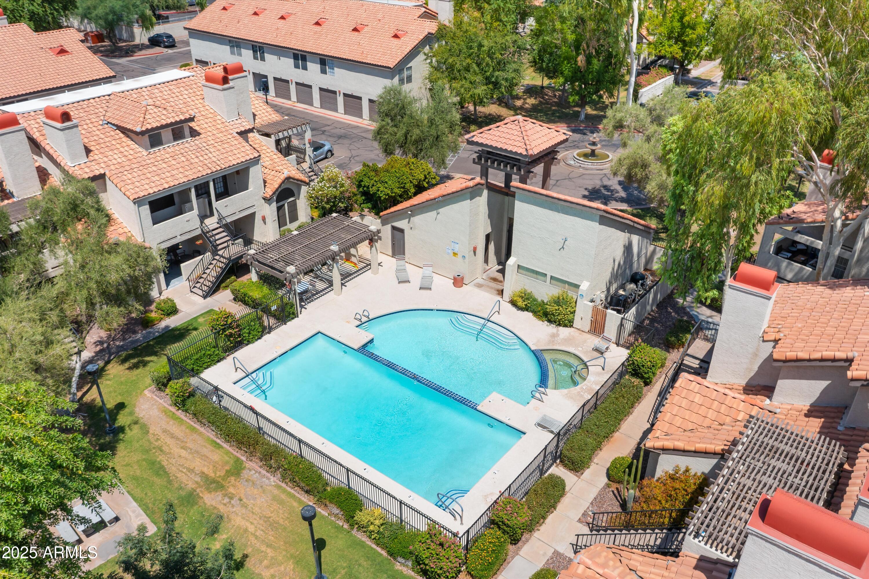 2333 East Southern Avenue, Unit 2067 Tempe, AZ 85282 - Photo 2 of 32 an aerial view of a house with a garden and swimming pool
