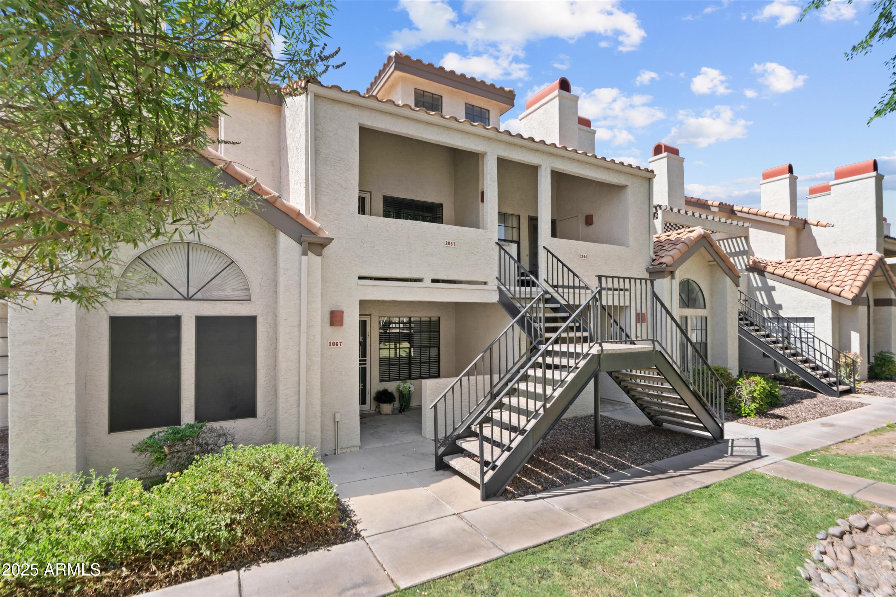 2333 East Southern Avenue, Unit 2067 Tempe, AZ 85282 - Photo 24 of 32 a view of a house with backyard and a tree