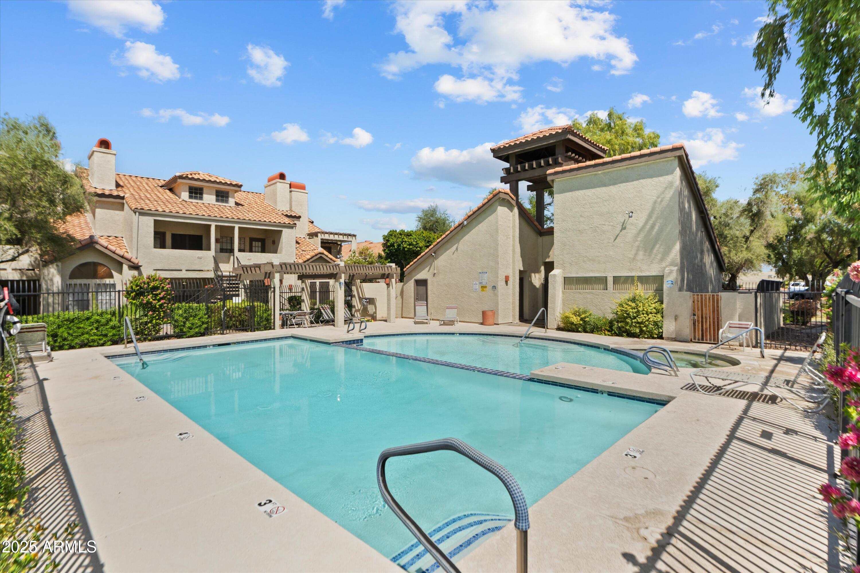 2333 East Southern Avenue, Unit 2067 Tempe, AZ 85282 - Photo 28 of 32 a view of a house with swimming pool and sitting area