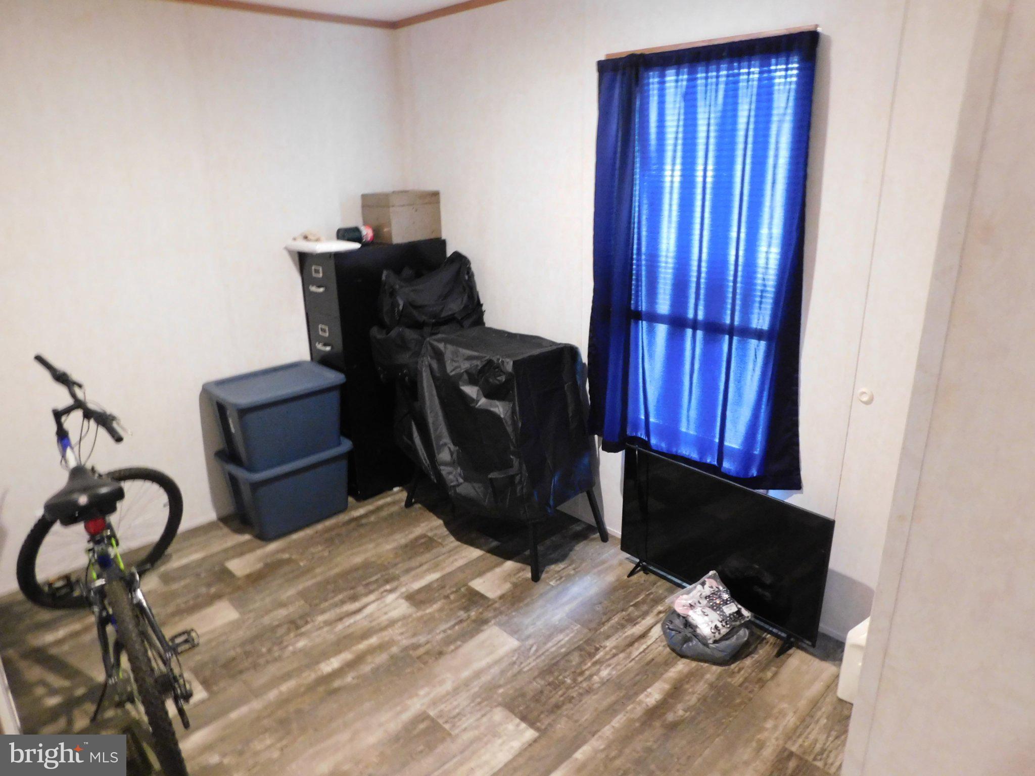 119 Meadow Lane Lititz, PA 17543 - Photo 9 of 13 a bed sitting in a bedroom next to a window