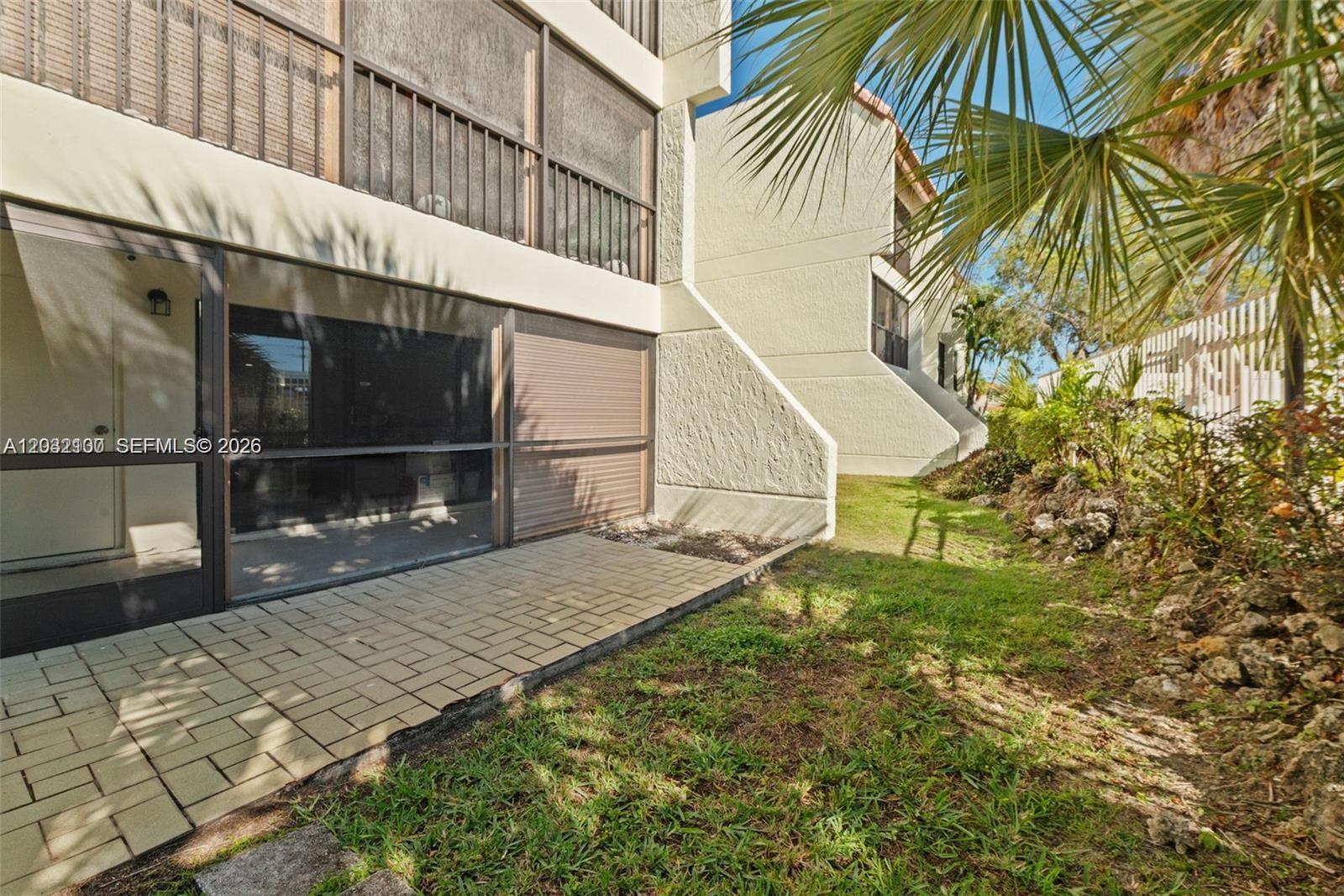 301 Racquet Club Road, Unit 104 Weston, FL 33326 - Photo 21 of 21 a view of a backyard