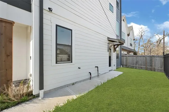 a view of backyard with seating area