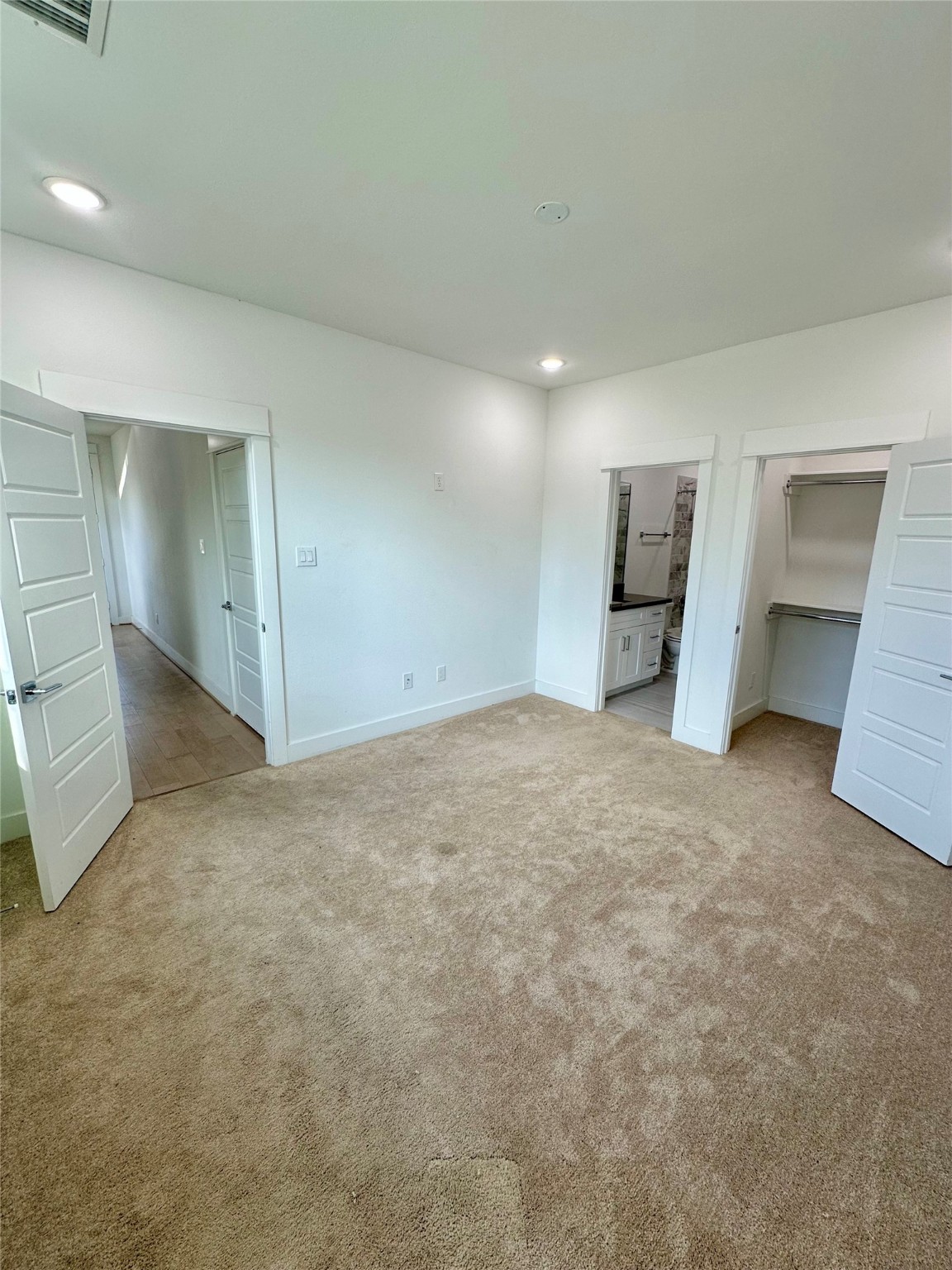 4623 Cochran Street Houston, TX 77009 - Photo 4 of 12 an empty room with a cabinet and mirrors