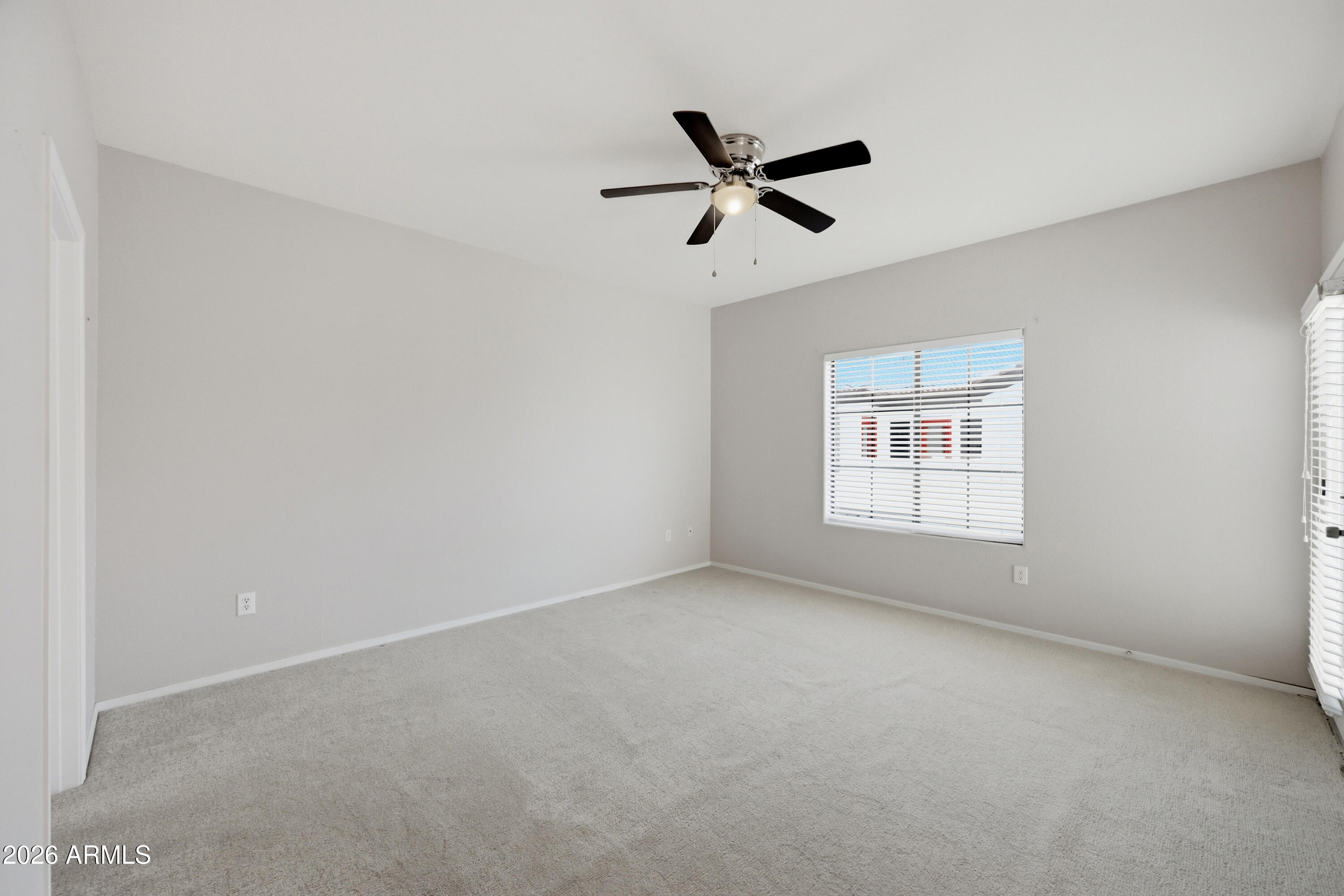 3150 East Beardsley Road, Unit 1009 Phoenix, AZ 85050 - Photo 25 of 31 an empty room with a window