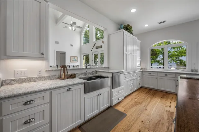 a bedroom with a large bed and a large window