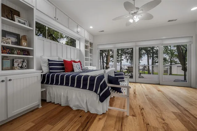 a spacious bedroom with a bed and a window