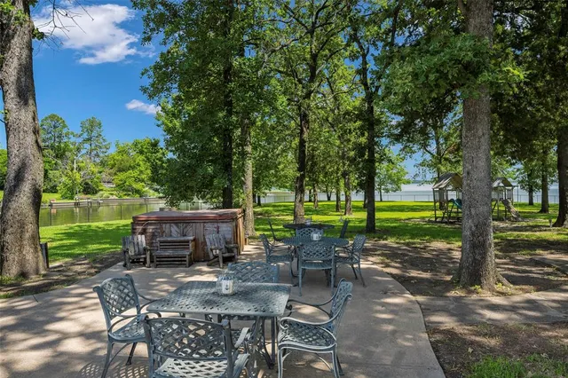 a kitchen with cabinets a sink and dishwasher with wooden floor