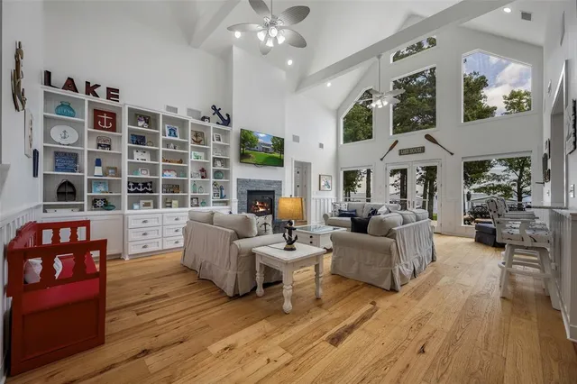 a living room with furniture and a large mirror