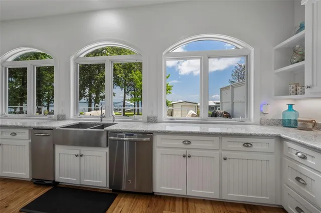 a living room with furniture and large windows