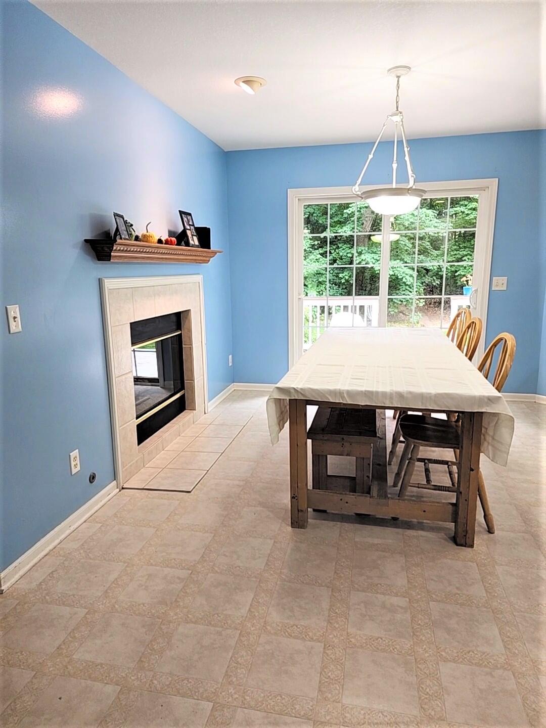 1917 Dykstra Road Muskegon, MI 49445 - Photo 8 of 29 Eating area with double sided fireplace