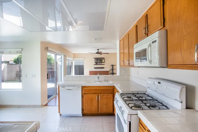 a kitchen with stainless steel appliances granite countertop a stove and a refrigerator