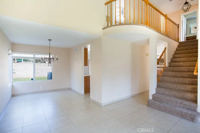 a view of an empty room with stairs