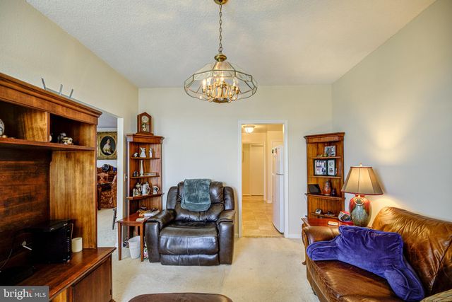 a kitchen with stainless steel appliances granite countertop a sink a stove and cabinets