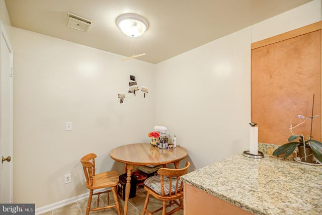 a kitchen with a sink appliances and cabinets