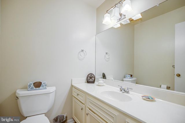 a view of hallway with chandelier and glass door