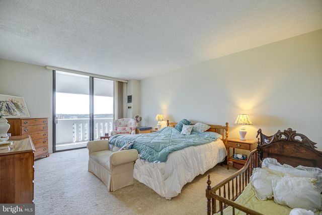 a bedroom with bed and window