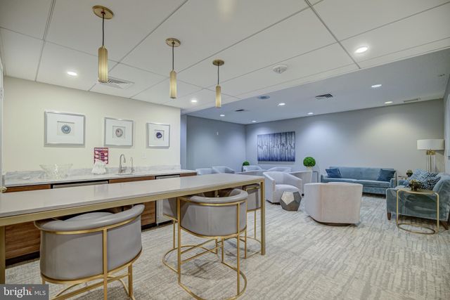a view of a swimming pool with lounge chair