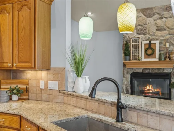 a view of a dining room with furniture large windows and wooden floor