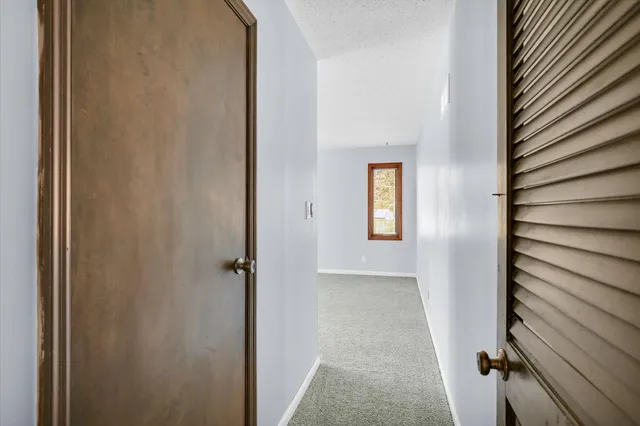 a view of an empty room with a large window