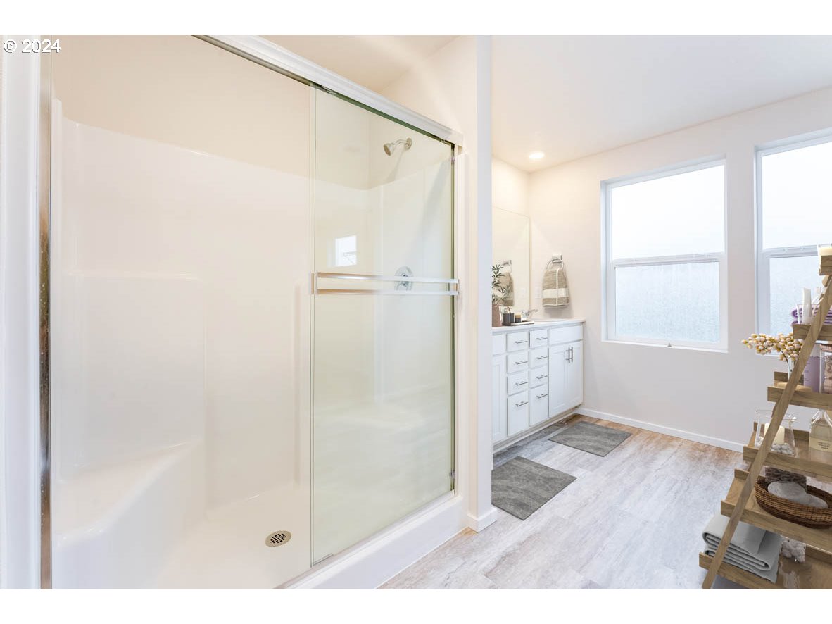 3362 Southeast 36th Street Gresham, OR 97080 - Photo 12 of 21 a bathroom with a glass shower door