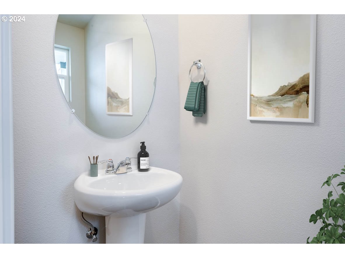 3362 Southeast 36th Street Gresham, OR 97080 - Photo 15 of 21 a bathroom with a sink and a mirror