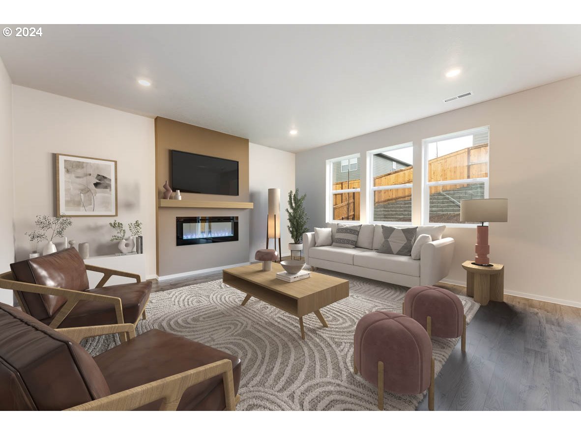 3362 Southeast 36th Street Gresham, OR 97080 - Photo 16 of 21 a living room with furniture a flat screen tv and a fireplace