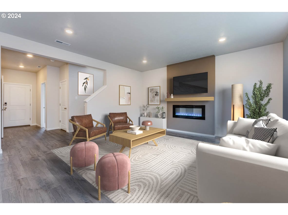 3362 Southeast 36th Street Gresham, OR 97080 - Photo 17 of 21 a living room with furniture a flat screen tv and a fireplace