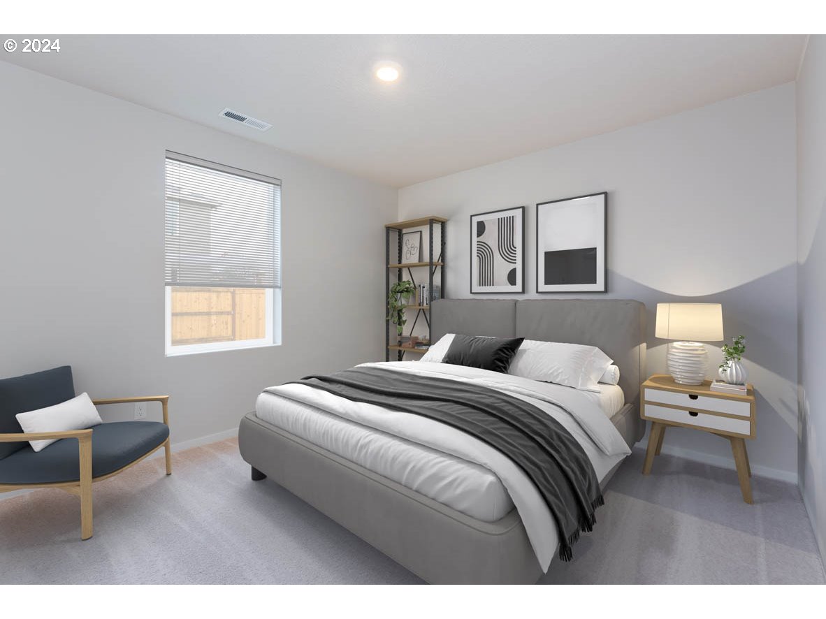 3362 Southeast 36th Street Gresham, OR 97080 - Photo 7 of 21 a bedroom with a bed and a chair